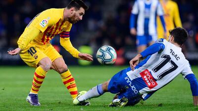 Barcelona's Argentine forward Lionel Messi (L) vies with Espanyol's Spanish defender Didac Vila. AFP