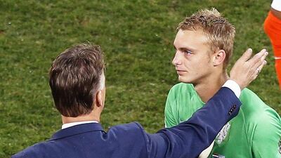 Netherlands coach Louis van Gaal consoles goalkeeper Jasper Cillessen after the Netherlands were knocked out in a penalty shootout by Argentina at the 2014 World Cup on Wednesday night. Chema Moya / EPA / July 9, 2014