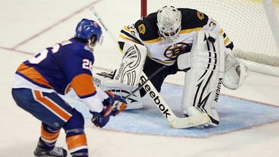Tim Thomas, right, is expected to anchor Boston between the pipes as the Bruins begin the defence of their Stanley Cup title.