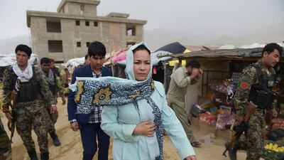 Masooma Muradi, the only female provincial governor in Afghanistan, walking through Nili, capital of Daikundi province, the remote region she governs on May 11, 2016. Shah Marai / Agence France-Presse