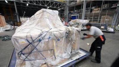 Cargo movement through Dubai and Abu Dhabi airports soared last month. Above, Dnata Cargo's warehouse in the Dubai Airport Free Zone. The National