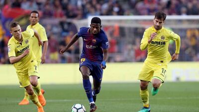 Ousmane Dembele, centre, scored two goals for Barcelona in the 5-1 Primera Liga win over Villarreal on Wednesday. Toni Albir / EPA
