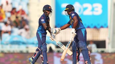 Pathum Nissanka, left, of Sri Lanka celebrates reaching his half century with teammate Kusal Perera. Getty
