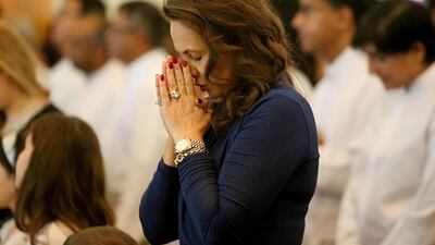 Christians celebrate at one of the many masses held in Dubai yesterday. St Francis of Assisi Church in Jebel Ali was the busiest. Satish Kumar / The National