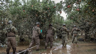 Soldiers from Japan's Self Defence Force search an apple orchard for bodies after heavy flooding caused by Typhoon Hagibis in Hoyasu near Nagano, Japan. Japan has mobilised over 100,000 rescue workers after Typhoon Hagibis, the most powerful storm in decades, swept across the country killing 66 people and leaving thousands injured and homeless. Getty Images