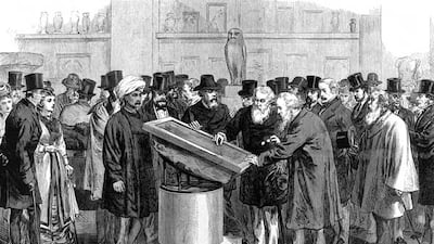 Experts inspecting the Rosetta Stone during the Second International Congress of Orientalists in 1874. Wikimedia Commons