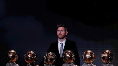 Barcelona's Lionel Messi with his six Ballon d'Or trophies. REUTERS/Christian Hartmann