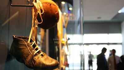 Football boots are on display in the hall of the Boca Hotel. AFP