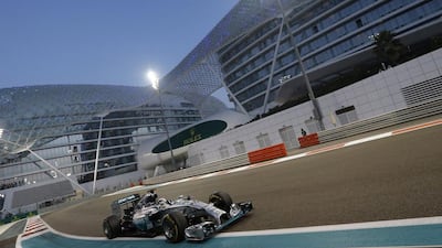 Mercedes driver Lewis Hamilton of Britain races in the lead during the Emirates Formula One Grand Prix at the Yas Marina racetrack in Abu Dhabi, United Arab Emirates, Sunday, Nov. 23, 2014. (AP Photo/Luca Bruno)