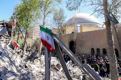 Journalists film outside a damaged mosque following strikes on Sharif University of Technology in Tehran on April 7, 2026. Gas supply was restored on April 6 after being cut in parts of Tehran following an attack in the early hours on a gas pressure reduction station and metering facilities at Sharif University of Technology, causing a leak. AFP