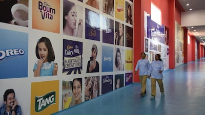 Indian workers walk through the Mondelez International facility in Andhra Pradesh. Arun Sankar / AFP