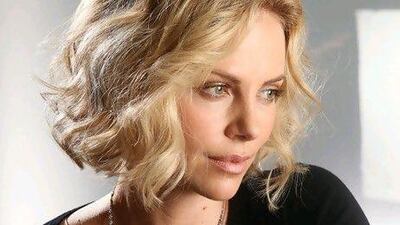 Actress Charlize Theron says she's reconciled to her new unattached life.