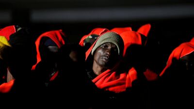 Migrants, intercepted off the coast in the Mediterranean Sea, wait to disembark from a rescue boat at the port of Malaga, southern Spain. Reuters