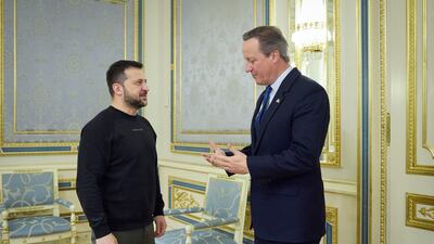 Ukrainian President Volodymyr Zelenskyy speaks to Britain's Foreign Secretary David Cameron in Kyiv. AP
