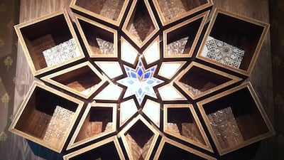 A wall-mounted bookcase inspired by the Islamic sunburst design, Shamsa. Courtesy Naseer Yasna