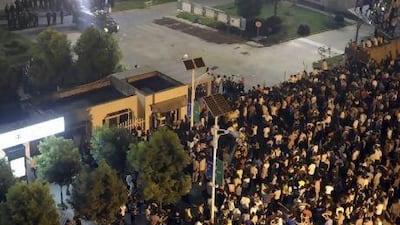 Police watch over villagers gathered in an anti-pollution protest outside the gates of the solar panel manufacturer Zhejiang Jinko Solar in Haining city in eastern China. AP Photo