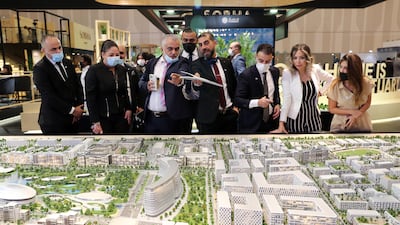 Visitors at the Arada stand on the first day of Cityscape Global held at Dubai Exhibition Centre. All photos: Pawan Singh / The National