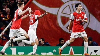 Arsenal's Andrey Arshavin, right, celebrates his goal with teammates at the Emirates stadium.