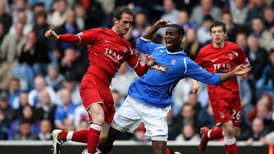 Mark Kerr, during his Aberdeen days, tackles Rangers' Maurice Edu. Pic: Jeff J Mitchell/Getty Images