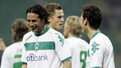 Werder Bremen's Claudio Pizarro, left, celebrates his equaliser against Inter Milan.
