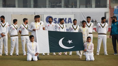 Pakistan players stand for the national anthems before start of play on the first day of the first Test against Sri Lanka in Rawalpindi. AP