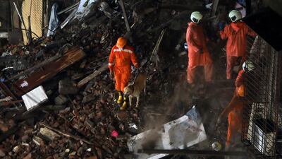National Disaster Response Force personnel look for survivors trapped in the rubble. REUTERS/Francis Mascarenhas