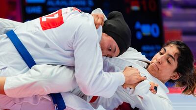 The UAE's Shamma Al Kalbani, right, on her way to victory against Azhar Salykova of Kazakhstan in the Jiu-Jitsu Asian Championship women’s 63-kilogram semi-finals. Photo: UAEJJF