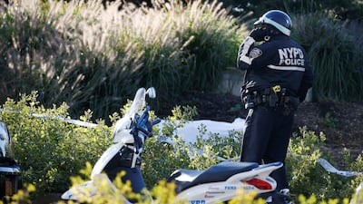 A NYPD officer stands guard at a crime scene near a bike path where a body is covered with a white-sheet in lower Manhattan in New York, NY, U.S., October 31, 2017. REUTERS/Brendan McDermid
