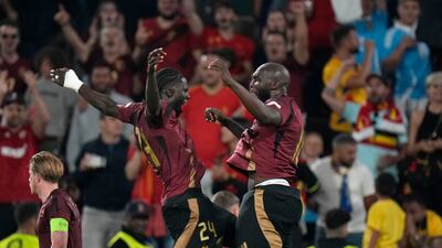 Belgium's Romelu Lukaku, right, celebrates with his teammate Amadou Onana. AP