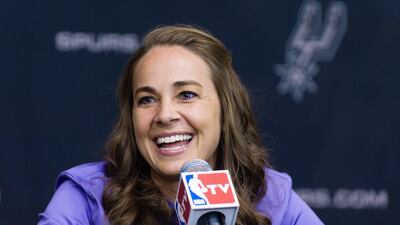 WNBA star Becky Hammon takes questions from the media at the San Antonio Spurs practice facility after being introduced as an assistant coach with the team on August 5, 2014 in San Antonio. The San Antonio Spurs hired WNBA star Becky Hammon on Tuesday, making her the first full-time, paid female assistant on an NBA coaching staff. Bahram Mark Sobhani / AP Photo