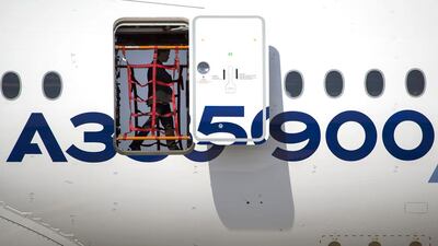 A visitor takes a tour inside the Airbus A350 XWB on display at MAKS 2015. Pavel Golovkin / AP Photo