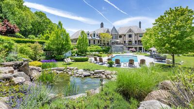 The estate has a heated, saltwater pool and koi pond. Courtesy Douglas Elliman Realty