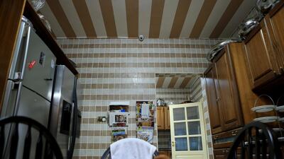 A CCTV camera looks down from a kitchen ceiling, an increasingly common sight in homes across the Emirates. Ravindranath K / The National