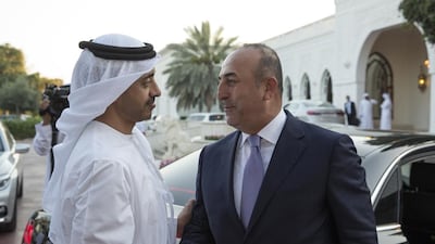 Sheikh Abdullah bin Zayed, Minister of Foreign Affairs and International Cooperation, bids farewell to Mevlut Cavusoglu, Turkey’s Minister of Foreign Affairs, after a meeting at a Sea Palace barza. Ryan Carter / Crown Prince Court - Abu Dhabi