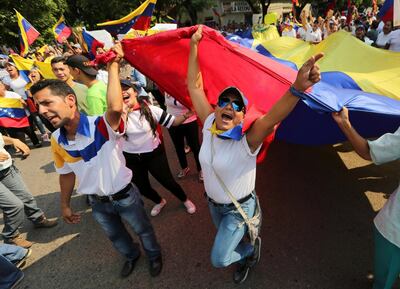 Demonstrators chant "Maduro out" during an anti-government protest against Venezuelan President Nicolas Maduro on the border with Colombia. AP