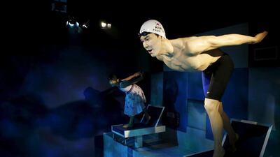 A girl gets ready to compete with the wax figure of South Korea’s Olympic swimming champion Park Tae-hwan at Grevin Wax Museum in Seoul, South Korea, on July 30, 2015. Kim Hong-Ji / Retuers
