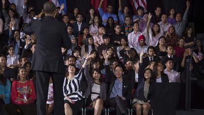 Members of the audience raise their hands as US President Barack Obama looks for someone to call upon during a meeting with young student leaders at the Young Southeast Asian Leadership Initiative during a visit to University of Malaya in Kuala Lumpur. Jim Watson / AFP Photo
