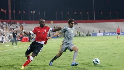 Grafite runs down Al Shabab's Walid Abbas at Al Rashid Stadium Mike Young / The National