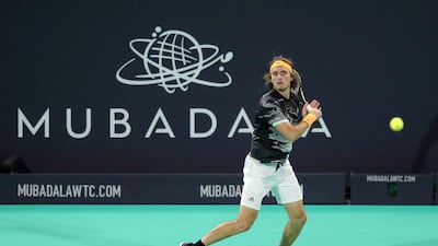 Stefanos Tsitsipas returns a shot to Rafael Nadal.