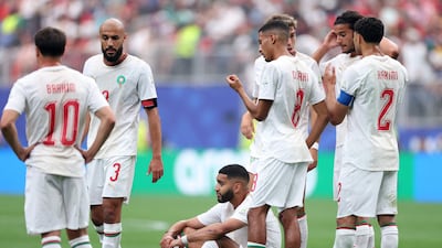 Morocco's Ismael Saibari sits down after picking up an injury during the World Cup last-16 match against Canada in Texas. AFP