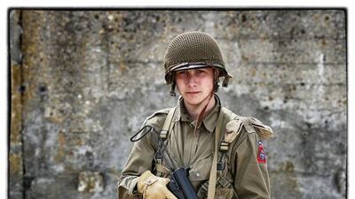 Matthieu Mesnil, from France, wears a replica uniform of an American Paratrooper of the 82nd Airborne Division.