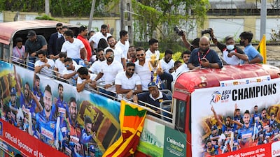 Sri Lankan players received a hero's welcome after landing in Colombo. AFP