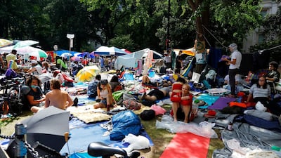 People gather in a park near city hall that has become the site of an Occupy City Hall protest in New York. EPA