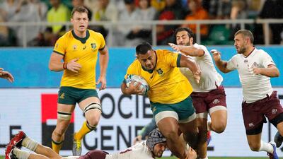 Australia's Taniela Tupou is tackled by Georgian defenders. AP