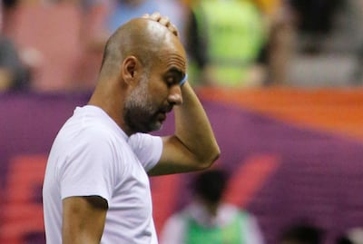 Manchester City manager Pep Guardiola is satisfied with how his team played in China. Thomas Peter / Reuters
