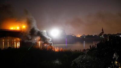 Smoke rises during ongoing anti-government protests in Baghdad. Reuters