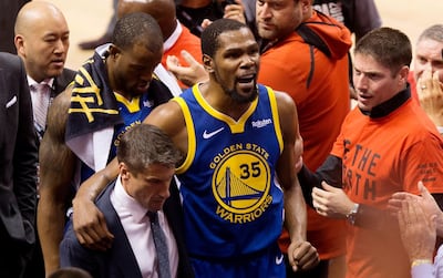 Golden State Warriors forward Kevin Durant leaves the court after sustaining an injury against the Toronto Raptors in Game 5 of the NBA Finals in Toronto. AP Photo