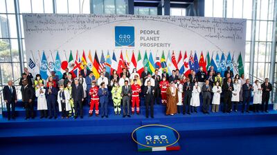 G20 leaders pose for a group photograph in Rome. G20 countries account for around 80 per cent of global emissions and the world's gross domestic product. EPA