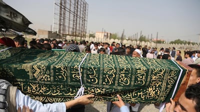 Men carry the coffin of a relative who died in Wednesday's deadly suicide bombing. AP