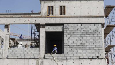 Infusing the workplace with migrants changes the prevailing configuration of workers. Antonie Robertson / The National